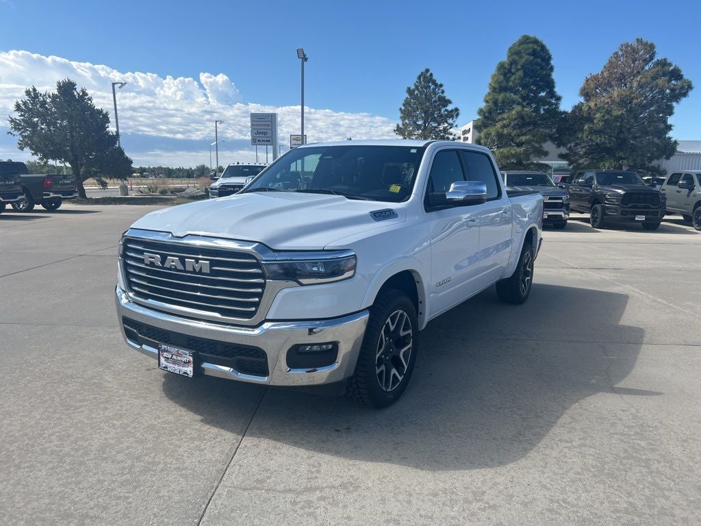 2025 RAM 1500 Laramie in Bright White Clearcoat — front three-quarter view